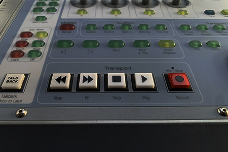 People at a concert facing the stage with various colours of paint powder in the air